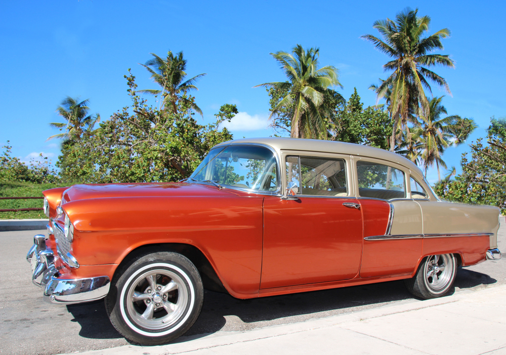 Vintage auto against the background of palm trees