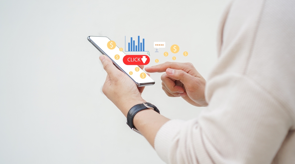 A mobile phone user clicking on an affiliate link